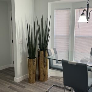 Snake grass on a gold-colored stainless steel vase