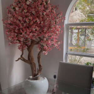 Pink cherry blossom tree on a  glossy white round vase